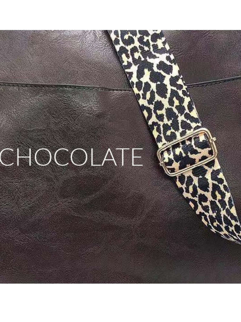 Chocolate  Crossbody bag with leopard print strap. Made with vegan leather, it features a full zipper closure, an exterior back zip pocket, two open slip pockets, and a zipper pocket inside.